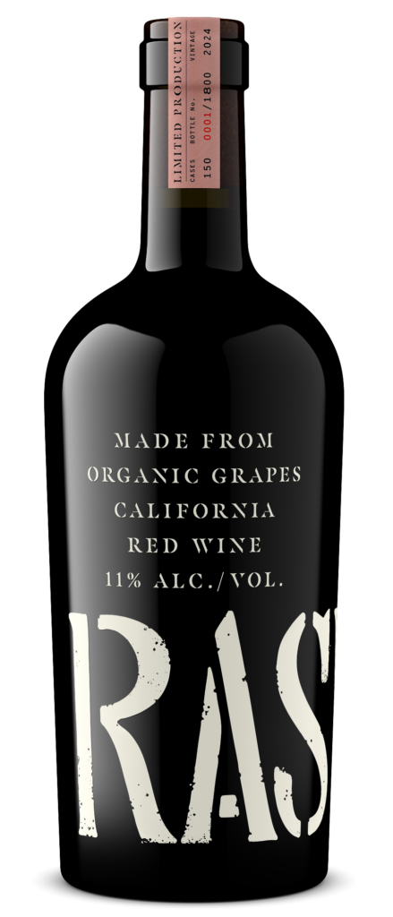 A bottle of California red wine labeled "RAS," made from organic grapes, 11% alcohol by volume, with a limited production tag on the neck.